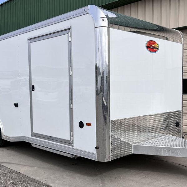 Large white enclosed tandem-axle cargo trailer with shiny rounded front corners, diamond-plate lower section, side door, and a polished aluminum tongue